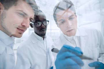 close up.a group of scientists discussing new ideas