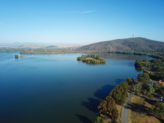 Panoramic view of Canberra (Australia) in daytime, featuring Lake Burley Griffin, Black Mountain and Telstra Tower.