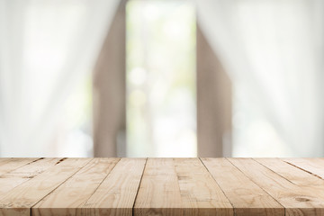 Empty wooden table and blur window background with copy space, display montage for product.