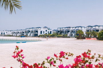 Beautiful white houses with blue roofs on the beach