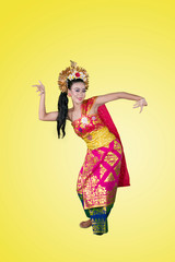 Traditional dancer dances with graceful gesture