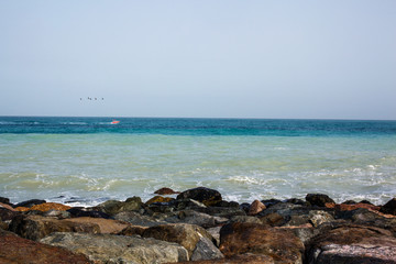Sea landscape, rocks, sea and blue sky