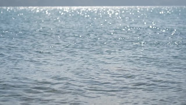 Gentle ocean waves reaching the beach