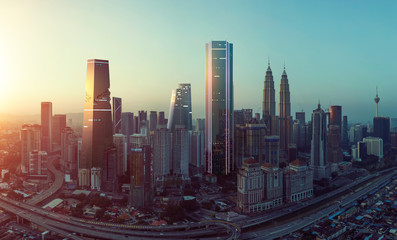 Naklejka na ściany i meble Future 3d modern neon light design skyscraper mix in sunset Kuala Lumpur city skyline , future vision of modern city , mixed media .