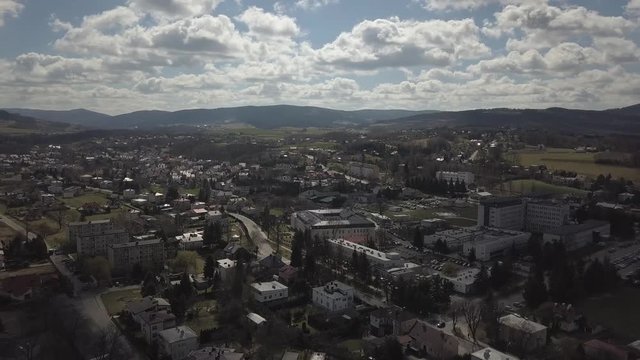 Gorlice, Poland - 3 9 2019: Panorama of the historic center of the European medieval city on the picturesque green hills. Trips to architectural monuments, temples, quarters and sports complex MOSiR