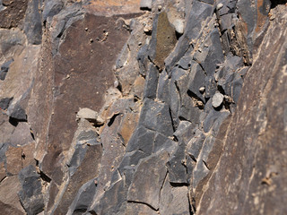 Rock textured abstract bakground. Stone ancient pattern closeup.