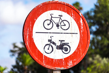 Outdoor road sign indicating forbidden traffic for bicycles, bikes and motorbikes on the jemaa el fna square in Marrakech, Morocco 