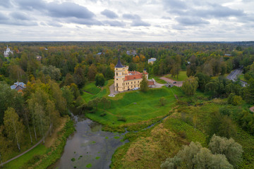 Fototapeta na wymiar The old Bip Castle in the autumn landscape (aerial photography). Pavlovsk, neighborhood of St. Petersburg, Russia