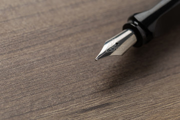 Black fountain pen on table