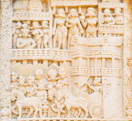 ancient stone sculptures carved into the wall of the temple