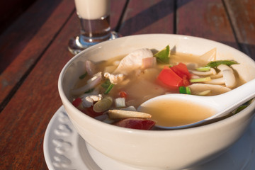 Hot and spicy soup with pork Thailand food recipe boiled pork with tomato and vegetables.