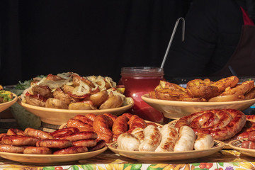 Culinary buffet with a presentation of a variety of healthy food - meat, sausage, grilled vegetables. Kitchen in the open air.