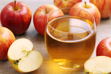 A glass with juice and apples