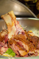  crispy prok knuckle in dish restaurant