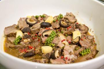  grilled beef with browne sauce in white dish