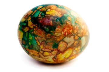 one yellow-green marbled egg isolated on white background