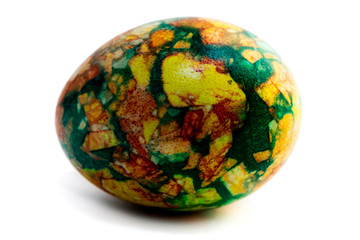 one yellow-green marbled egg isolated on white background