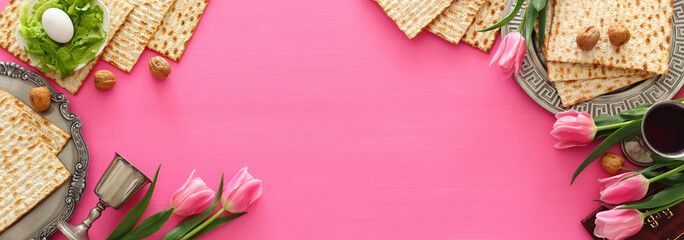 Pesah celebration concept (jewish Passover holiday). Traditional book with text in hebrew: Passover...