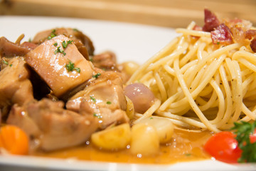  delicious beef stew with spaghetti on plate