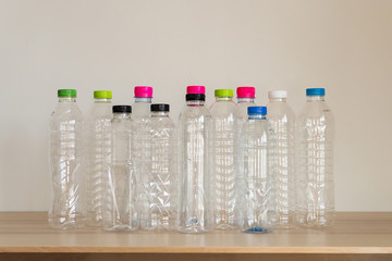set of many plastic bottle on wood table, recycling concept