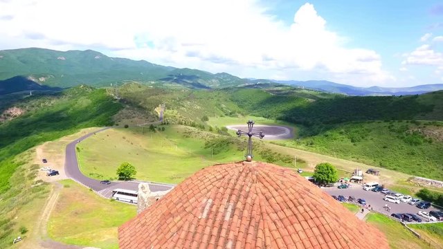 Old georgian Svetitskhoveli Cathedral In Mtskheta with sky and green hills