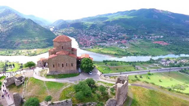 Old georgian Svetitskhoveli Cathedral In Mtskheta with sky and green hills