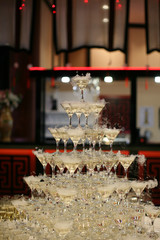 Pyramid of champagne glasses. In holliday