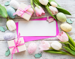 Gift boxes, easter eggs and tulips bouquet