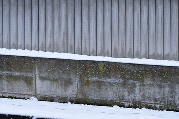 wall of concrete posts in winter