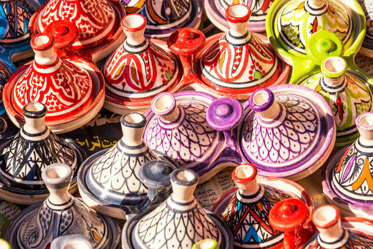 ESSAOUIRA, MOROCCO - NOVEMBER 20, 2018: Moroccan pottery in Essaouira. Colorful ceramics and pottery displayed outside a shop. Beautiful oriental design with plenty of colors