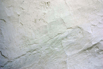 Old cracked whitewashed wall of the wattle and daub house. Close up - obrazy, fototapety, plakaty