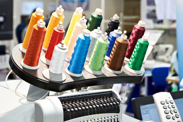 Bobbins with colored thread for industrial textile