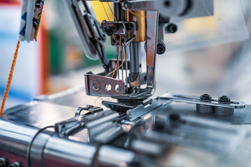 Professional sewing machine close-up. Modern textile industry.
