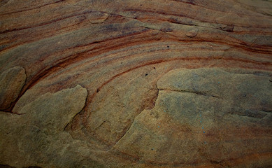 texture of a large boulder stone with beautiful natural divorces and patterns