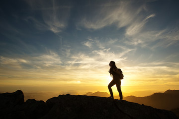 Hiker meets the sunset on the Moro rock in Sequoia national park, California, USA.