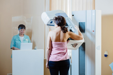 A woman patient having mammography examination at hospital. - obrazy, fototapety, plakaty