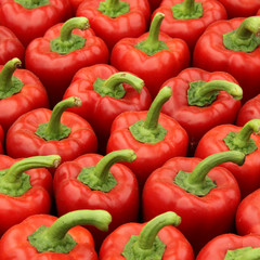 Full frame image of perfect red bell peppers on display in a market