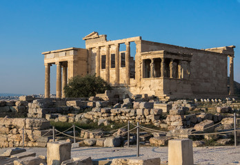 View of Erechtheion and porch of Caryatids on Acropolis, Athens, Greece, against sunset