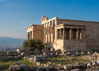 View of Erechtheion and porch of Caryatids on Acropolis, Athens, Greece, against sunset
