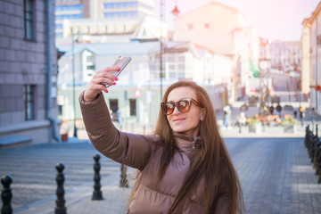 Fototapeta premium Attractive young woman making selfie