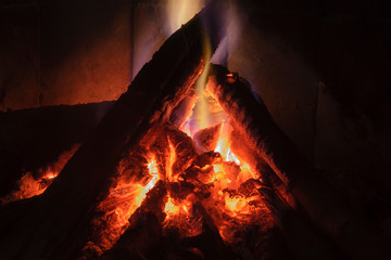 Close up shot of burning firewood in the fireplace