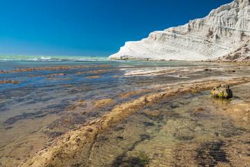 The Scala dei Turchi (Stair of the Turks), a spectacular white rocky cliff on the coast of Sicily, Italy. The rock formation in the shape of a staircase lies between two sandy beaches.