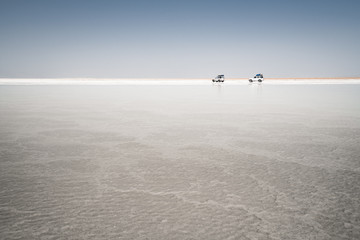 Fototapeta na wymiar Offroad expedition through salt lake in the danakil depression in ethiopia