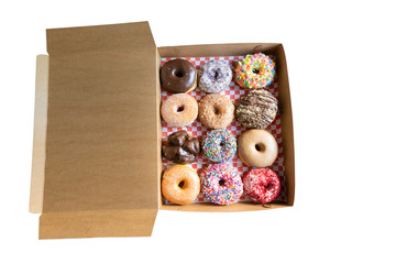A box contains one dozen donuts - isolated on white background