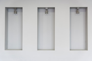 Empty niches in wall with spot lights photo	