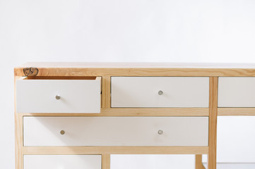 Handmade wooden table with drawers on white background
