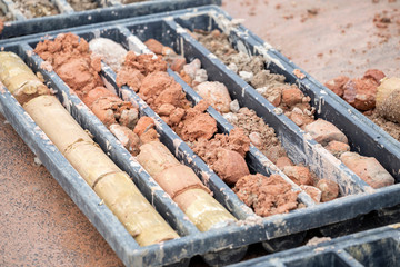 Obtaining soil samples in plastic box