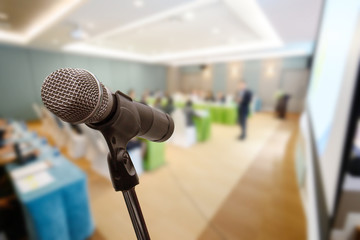 Microphone over the blurred business forum Meeting or Conference Training Learning Coaching Room Concept, Blurred background.