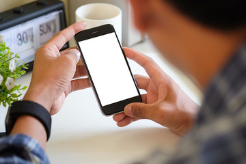 Cropped shot view of man hands holding smart phone with blank copy space screen for your text...