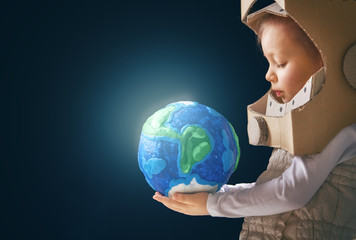 Kid with globe.